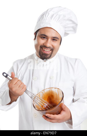 Porträt des Küchenchefs, die Schokolade in einer Schüssel mischen Stockfoto