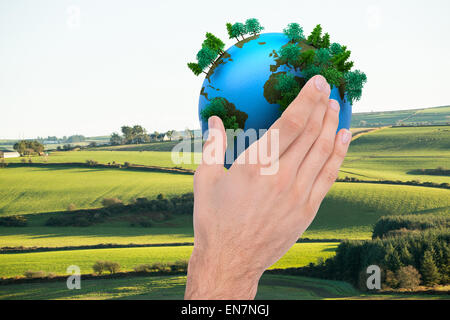 Zusammengesetztes Bild des Kaufmanns an Hand heraus in Präsentation Stockfoto