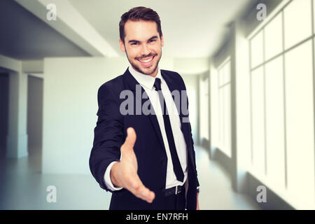 Zusammengesetztes Bild des Porträts von lächelnden Geschäftsmann bietet handshake Stockfoto