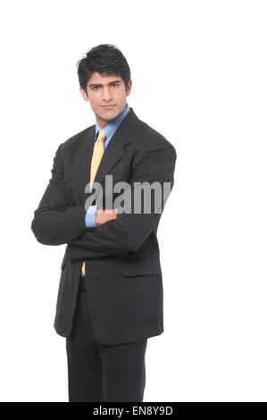 Ein Geschäftsmann mit gefalteten Händen stehend Stockfoto