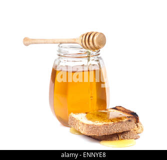 Geröstetes Brot mit Honig isoliert auf weißem Studio-Hintergrund. Stockfoto
