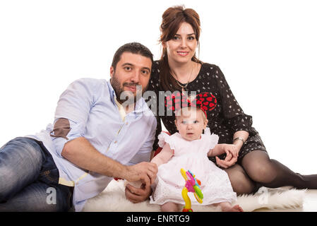 Schönheit-Familie mit Babymädchen sitzen auf einer Decke Stockfoto