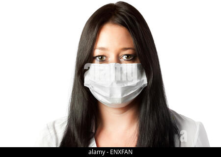 attraktive Brünette Krankenschwester in Maske isoliert Stockfoto