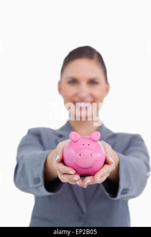 Sparschwein mit einem Lächeln Bankkaufmann angeboten werden Stockfoto