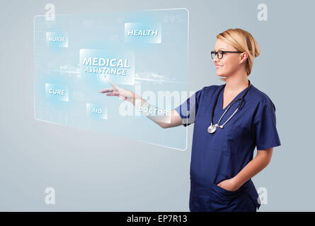 Junge Krankenschwester, die moderne medizinische Art der Knöpfe drücken Stockfoto