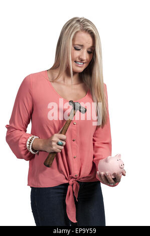 Frau verwahrenden Piggy bank Stockfoto