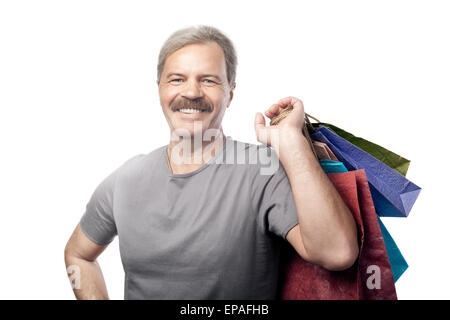 Reifen Mann mit Einkaufstüten isoliert lächelnd Stockfoto