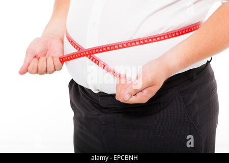 Dicker Mann hält ein Maßband Stockfoto