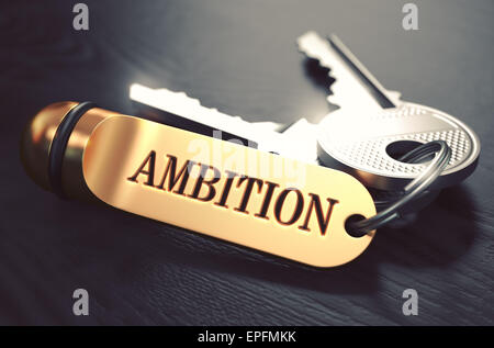 Ehrgeiz-Konzept. Tasten mit goldenen Schlüsselanhänger auf schwarzer Holztisch. Nahaufnahme, Tiefenschärfe, 3D Rendering. Getönten Image. Stockfoto