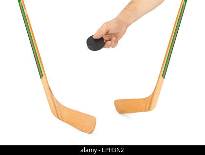 Eis-Hockey-Stick und Hand mit puck Stockfoto