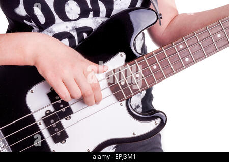 Hände einer weiblichen Teenager spielt Gitarre, Isolated on white Stockfoto