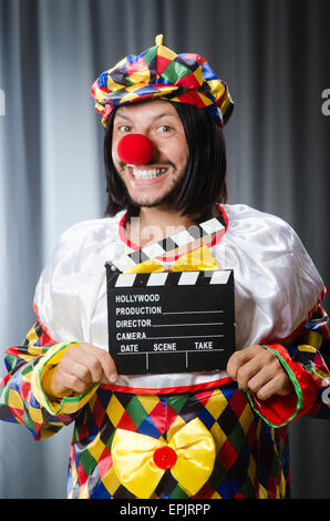 Clown mit Film-Klappe Stockfoto