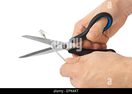 Hand mit Schere und Telefon-Kabel Stockfoto