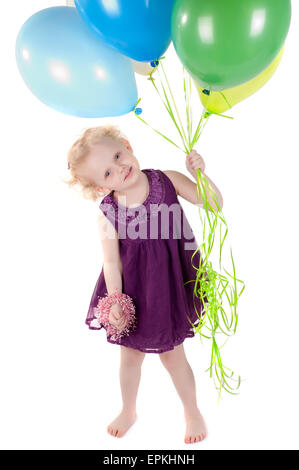 Kleine süße Mädchen in Tracht mit Luftballons Stockfoto