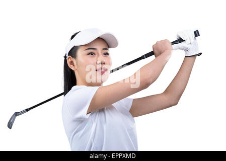 Junge weibliche Golfer schwingen Golf club Stockfoto