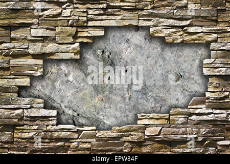 Steinmauer mit einem großen Loch in der Mitte ein Grunge-Stil Stockfoto