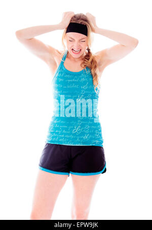 Frustrierte Frau ihr Haar ziehen Stockfoto