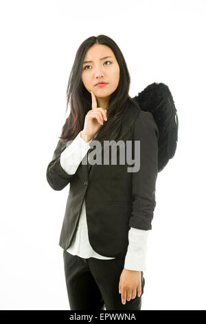 Attraktive asiatische junge Frau Engel und Dämon Stockfoto