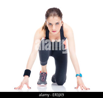 Sportliche Frau Läufer in Startposition isoliert auf weißem Hintergrund Stockfoto