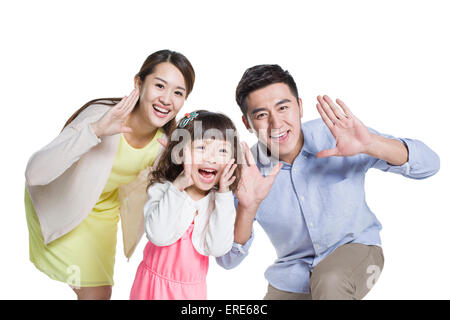 Glückliche junge Familie schreiend zusammen Stockfoto