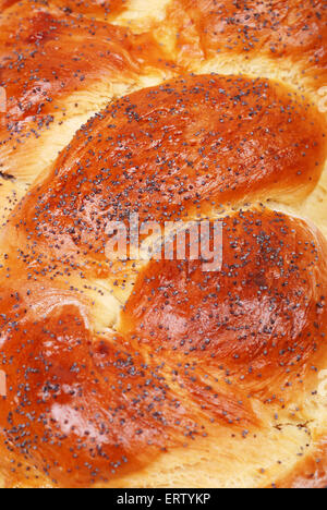 Hintergrund von hausgemachten Brötchen mit Mohn Stockfoto