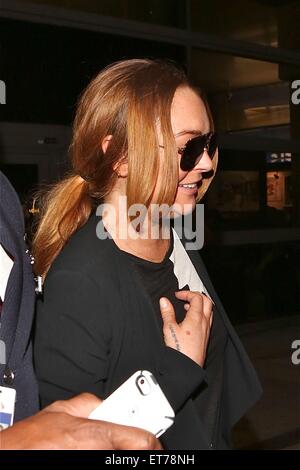 Lindsay Lohan kommt auf einem Flug nach Los Angeles International Airport (LAX) Featuring: Lindsay Lohan Where: Los Angeles, California, Vereinigte Staaten von Amerika bei: 16. Dezember 2014 Credit: WENN.com Stockfoto