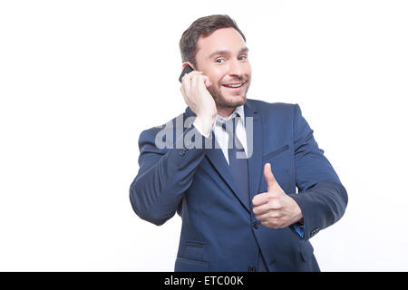 Lächelnde Geschäftsmann am Telefon sprechen Stockfoto