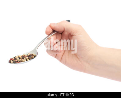 Hand hält einen Löffel voll von Pfeffer Gewürze Stockfoto