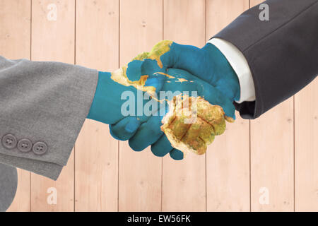 Zusammengesetztes Bild des Handshakes zwischen zwei Geschäftsleute Stockfoto
