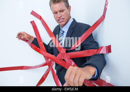 Geschäftsmann von Bürokratie gefangen Stockfoto