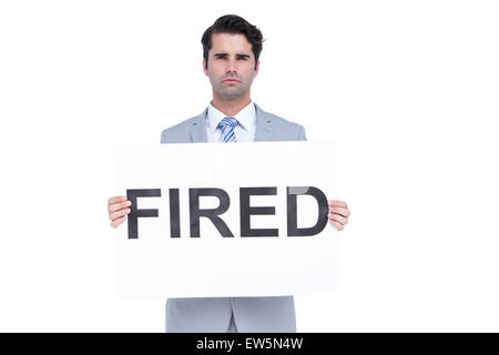 Traurig Geschäftsmann mit einem gebrannten Schild Stockfoto