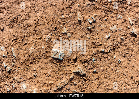 Roter Sand, Steine Textur Hintergrund am Sportplatz Läufer, Anschluss Stockfoto