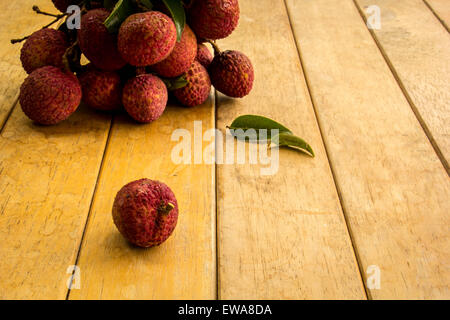 Litschi, rot, Bodenplatten, Bodenbelag, Hintergrund, Textur, Obst. Stockfoto