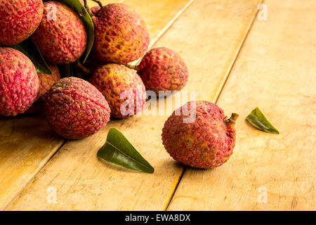 Litschi, rot, Bodenplatten, Bodenbelag, Hintergrund, Textur, Obst. Stockfoto