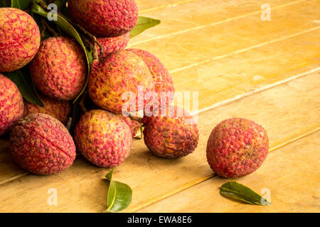 Litschi, rot, Bodenplatten, Bodenbelag, Hintergrund, Textur, Obst. Stockfoto