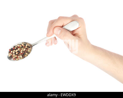 Hand hält einen Löffel voll von Pfeffer Gewürze Stockfoto