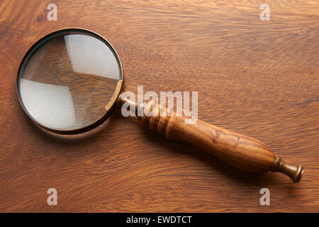 Magnifying Glass On Wooden Background Stockfoto
