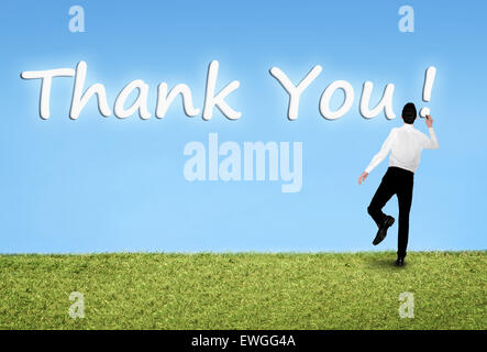 Geschäftsmann am Himmel danke Wort schreiben Stockfoto