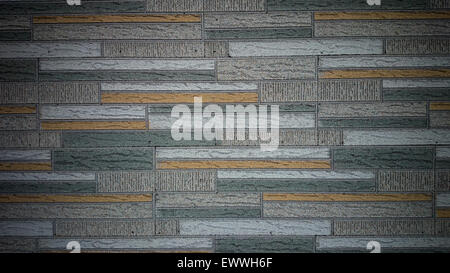 Alte Mauer aus farbigen Harz Steinplatten, Hintergrund Stockfoto