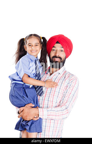 2 indische Punjabi Vater und Schüler Tochter Pflege Stockfoto