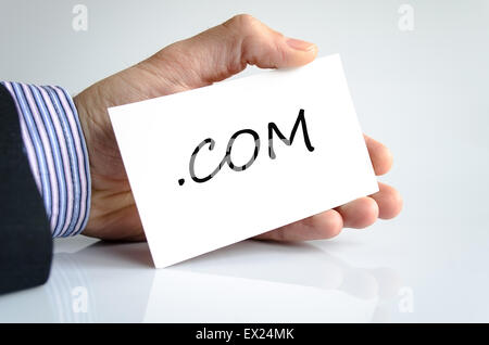 Com-Notiz in Business Mann hand Stockfoto