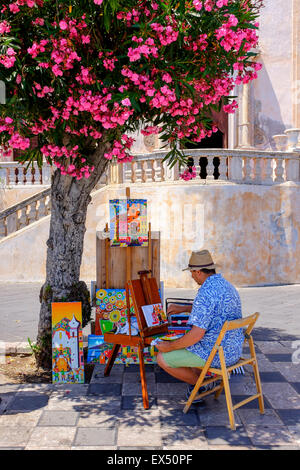 Lokale Künstler Malerei unter einem Baum Blüte außerhalb des Duomo, Corso Umbert, Taormina, Sizilien, Italien Stockfoto