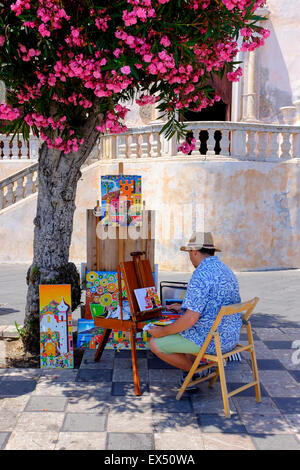 Lokale Künstler Malerei unter einem Baum Blüte außerhalb des Duomo, Corso Umbert, Taormina, Sizilien, Italien Stockfoto