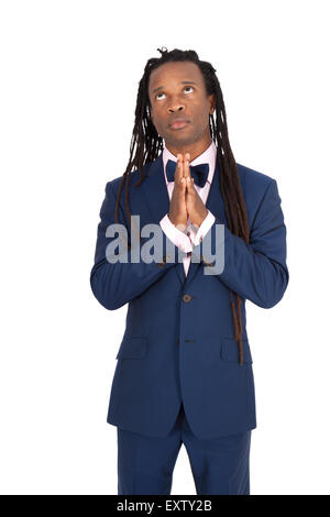 Gut aussehender Mann mit Dreadlocks, die verschiedenen Ausdrücke in verschiedenen Arten von Kleidung zu tun: beten Stockfoto