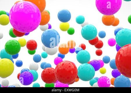Bunte Kugeln auf einem weißen Hintergrund schweben. Ein 3D Rendering. Stockfoto
