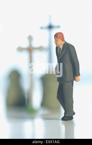 Miniatur-Figur auf einer Beerdigung Stockfoto