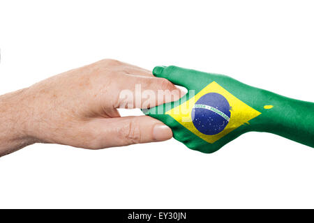 Zwei Hände und brasilianische Flagge Stockfoto