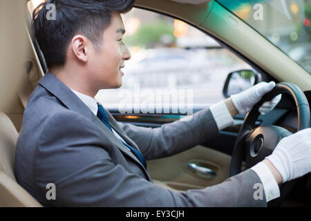 Chauffeur, Auto zu fahren Stockfoto