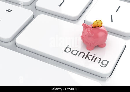 Rosa Sparschwein mit goldenen Medaille auf der Computertastatur. Online-Banking-Konzept Stockfoto