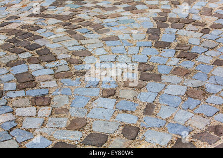 Stein-Pflaster-Textur. Granit gepflasterten Gehweg Hintergrund. Zusammenfassung Hintergrund der alten gepflasterten Gehweg Nahaufnahme. Stockfoto